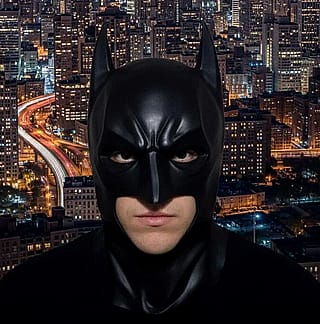 Took an image of me in costume from a few Halloweens ago. AI Gemini cleaned it up and I asked for a city skyline background at night. 🎃🦇'