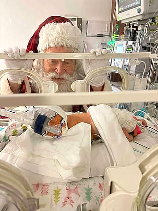 Santa visiting my grand daughter in the nic icu'