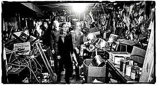 Create an image of a random scene taken with a spartus film press camera with the flash on, chaotic, uncanny - edited the current trend prompt a little'