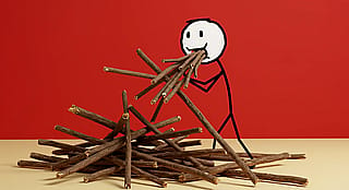 a stickman eating sticks'